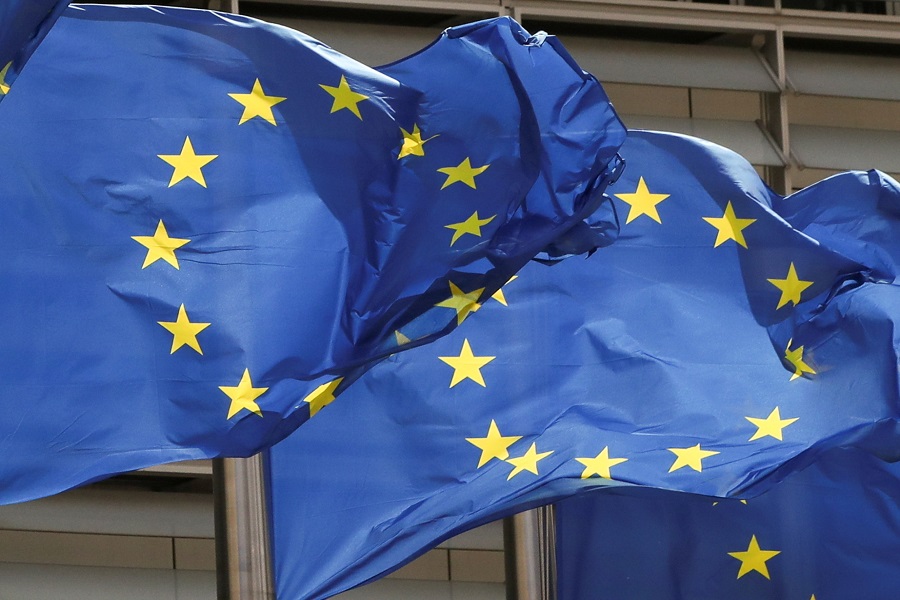 FILE PHOTO: European Union flags flutter outside the EU Commission headquarters in Brussels