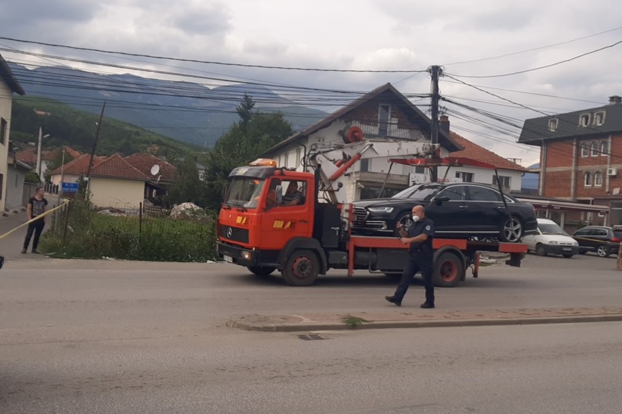 The vehicles are being removed from the place where the double murder took place in Peja