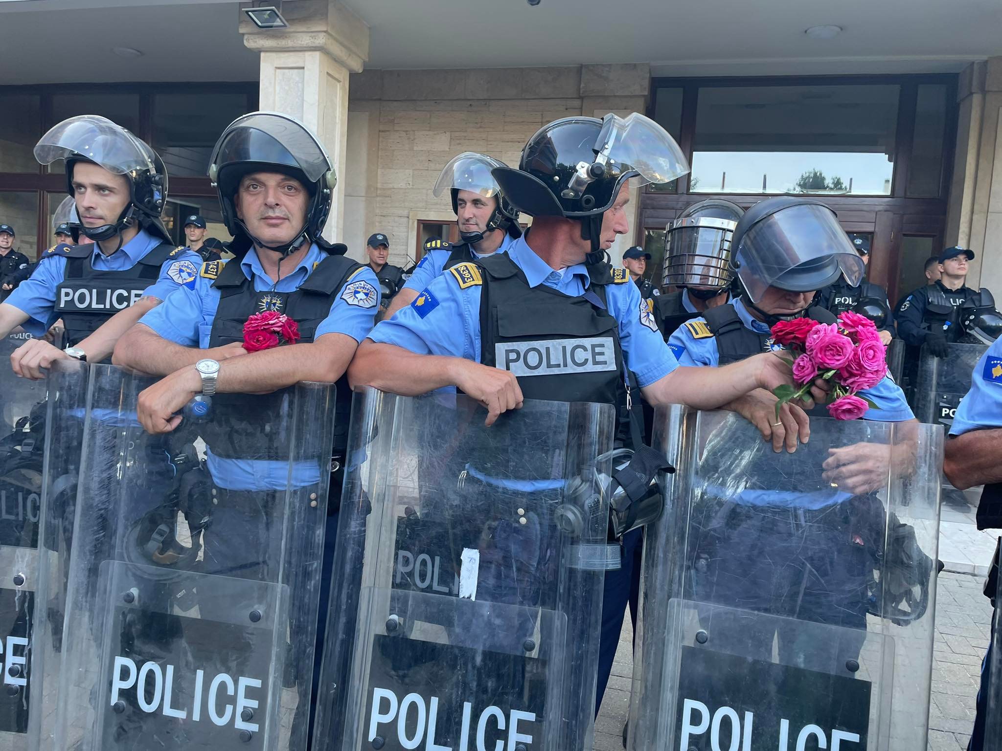 The protest ends with flowers for the police officers