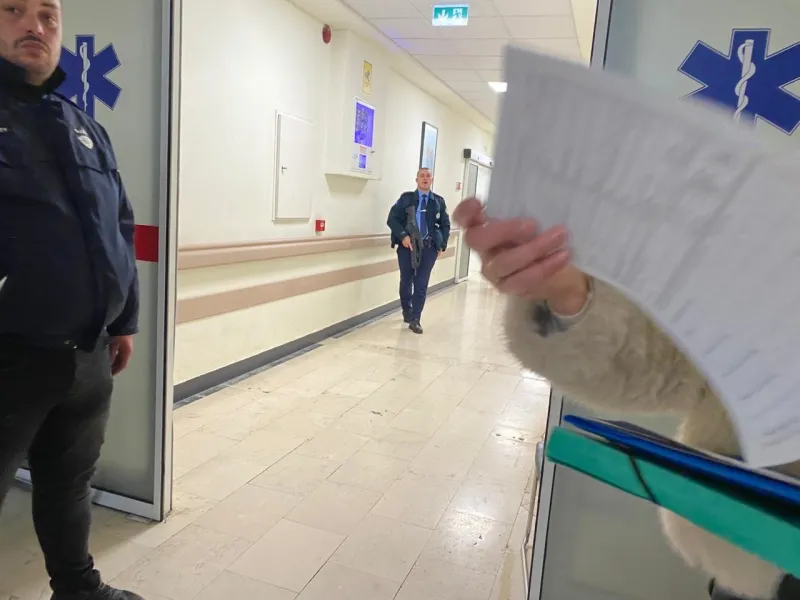 The suspect in the killing of the two brothers is brought to the Emergency Clinic
